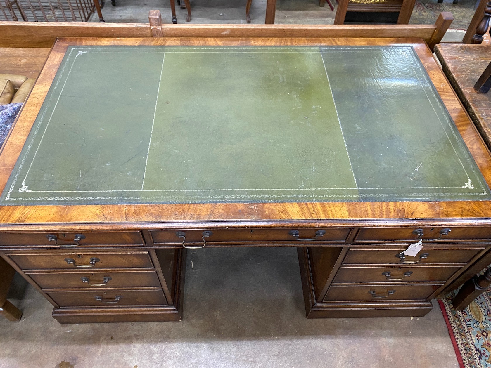 A reproduction George III style mahogany pedestal partner's desk, width 152cm, depth 91cm, height 76cm